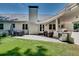 Brick home with an outdoor seating area, barbecue, and lush green backyard at 2936 Randolph Ne Rd, Atlanta, GA 30345
