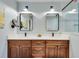 Bathroom featuring double vanity with dark wood cabinets, white countertops, and modern fixtures at 2936 Randolph Ne Rd, Atlanta, GA 30345