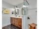 Bathroom featuring a tiled shower, dual vanity, and unique hexagon patterned floor tiles at 2936 Randolph Ne Rd, Atlanta, GA 30345
