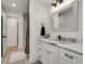 Modern bathroom with white vanity, marble countertop, and grey floor tiles at 2936 Randolph Ne Rd, Atlanta, GA 30345