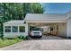 Carport featuring an attached garage and a white Toyota Tacoma at 2936 Randolph Ne Rd, Atlanta, GA 30345