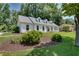 Charming single-story home with a well-manicured lawn, classic white brick, and dormer windows at 2936 Randolph Ne Rd, Atlanta, GA 30345