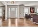 Bright foyer featuring hardwood floors, white trim, and a view into the living area at 2936 Randolph Ne Rd, Atlanta, GA 30345