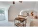 Bright upper hallway with carpet, a serving cart, and white trim work throughout the interior architecture at 2936 Randolph Ne Rd, Atlanta, GA 30345