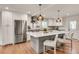 Bright kitchen with stainless appliances, island seating, and modern pendant lighting at 2936 Randolph Ne Rd, Atlanta, GA 30345
