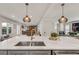 Open concept kitchen with stainless steel sink and view into the living room at 2936 Randolph Ne Rd, Atlanta, GA 30345