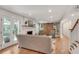 Bright living room with fireplace, hardwood floors, and large sliding barn door at 2936 Randolph Ne Rd, Atlanta, GA 30345
