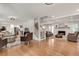 Open-concept living space with hardwood floors, fireplace, and seamlessly connected dining area at 2936 Randolph Ne Rd, Atlanta, GA 30345