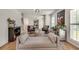 Inviting living room featuring hardwood floors, neutral decor, and a stylish rug at 2936 Randolph Ne Rd, Atlanta, GA 30345