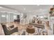 Open-concept living room with hardwood floors and neutral decor flows into a modern white kitchen at 2936 Randolph Ne Rd, Atlanta, GA 30345
