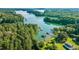 Picturesque aerial view of a lakefront community with lush greenery and private boat docks at 3540 Pilgrim Mill Rd, Cumming, GA 30041
