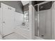 Well-lit bathroom with a soaking tub and a glass-enclosed shower at 3540 Pilgrim Mill Rd, Cumming, GA 30041