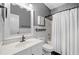 Bathroom with a vanity, toilet, and a tub with a shower curtain at 3540 Pilgrim Mill Rd, Cumming, GA 30041