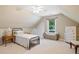 Cozy bedroom with sloped ceilings, a ceiling fan and a window view at 3540 Pilgrim Mill Rd, Cumming, GA 30041