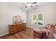 Bright bedroom with a large dresser and a patterned chair at 3540 Pilgrim Mill Rd, Cumming, GA 30041