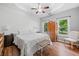 Bright bedroom with hardwood floors, tray ceilings, and ample natural light at 3540 Pilgrim Mill Rd, Cumming, GA 30041