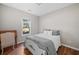 Cozy bedroom with a neutral color scheme and hardwood flooring at 3540 Pilgrim Mill Rd, Cumming, GA 30041