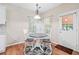 Dining area with hardwood floors, a view into the back and a stylish light fixture at 3540 Pilgrim Mill Rd, Cumming, GA 30041