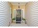 Charming front entrance with black door, sidelights, and decorative potted plants at 3540 Pilgrim Mill Rd, Cumming, GA 30041