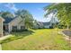 A view of the home showcasing a well-manicured lawn, complemented by lush landscaping and mature trees at 3540 Pilgrim Mill Rd, Cumming, GA 30041