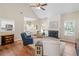 Bright living room with vaulted ceilings, fireplace, hardwood floors, and an open kitchen at 3540 Pilgrim Mill Rd, Cumming, GA 30041