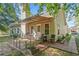 A cozy rear patio with an awning and lush landscaping provides a private outdoor retreat at 3540 Pilgrim Mill Rd, Cumming, GA 30041