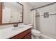 Bathroom with updated vanity, walk-in shower with decorative tile, and tiled floor at 626 Cheatham Sw Dr, Marietta, GA 30064