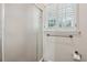 The bathroom includes a glass enclosed shower and plantation shutters on the window at 626 Cheatham Sw Dr, Marietta, GA 30064