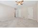 Bedroom with neutral carpet, two closets, and two doors at 626 Cheatham Sw Dr, Marietta, GA 30064