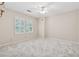 Bright bedroom with plush carpeting, white trim and multiple windows with plantation shutters at 626 Cheatham Sw Dr, Marietta, GA 30064