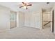 Bedroom with neutral walls, shutters, carpet, and closet at 626 Cheatham Sw Dr, Marietta, GA 30064