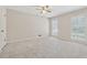 Bedroom with neutral carpet, two shuttered windows at 626 Cheatham Sw Dr, Marietta, GA 30064