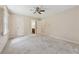 Spacious bedroom featuring plush carpeting, neutral paint, and a ceiling fan at 626 Cheatham Sw Dr, Marietta, GA 30064