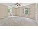 Bedroom features plush carpeting, natural light, and neutral color palette at 626 Cheatham Sw Dr, Marietta, GA 30064
