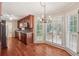 Kitchen offers stainless steel appliances, wood floors, recessed lighting, and large shuttered windows at 626 Cheatham Sw Dr, Marietta, GA 30064
