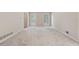 Spacious, carpeted living room with plantation shutters, offering a clean and inviting space at 626 Cheatham Sw Dr, Marietta, GA 30064