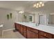 Bathroom featuring a double vanity with granite countertops and a large mirror at 1019 Avonley Creek Trce, Sugar Hill, GA 30518