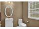 Bathroom featuring a vanity with white countertop and a window bringing in natural light at 1019 Avonley Creek Trce, Sugar Hill, GA 30518