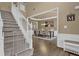 Open-concept dining room features a view of the staircase and elegant decor at 1019 Avonley Creek Trce, Sugar Hill, GA 30518