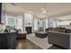 Inviting living room features a fireplace, hardwood floors, and comfortable seating at 1019 Avonley Creek Trce, Sugar Hill, GA 30518