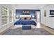 Serene main bedroom features a tray ceiling, accent wall, plush carpeting, and an ensuite bathroom at 1019 Avonley Creek Trce, Sugar Hill, GA 30518