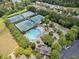 Aerial view of community amenities including swimming pool, tennis courts, basketball court, and playground at 214 Harmony Lake Dr, Canton, GA 30115