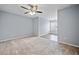 Comfortable bedroom with a ceiling fan, plush carpet, and plenty of natural light at 214 Harmony Lake Dr, Canton, GA 30115