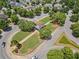 Aerial view of landscaped community green space with sidewalks and gazebo surrounded by homes at 214 Harmony Lake Dr, Canton, GA 30115
