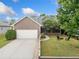 Charming home with a well-maintained front yard, inviting driveway, and attractive curb appeal at 214 Harmony Lake Dr, Canton, GA 30115