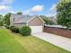 Charming two-story home featuring manicured landscaping, a two-car garage and a driveway at 214 Harmony Lake Dr, Canton, GA 30115