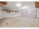 Spacious two-car garage with ample room for storage and a garage door at 214 Harmony Lake Dr, Canton, GA 30115
