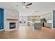 Open living room featuring a fireplace and view into the kitchen at 214 Harmony Lake Dr, Canton, GA 30115