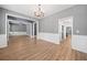 Open-concept living room featuring hard wood floors, gray walls and white trim at 214 Harmony Lake Dr, Canton, GA 30115