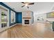 Living room featuring modern french doors, windows and a beautiful fireplace at 214 Harmony Lake Dr, Canton, GA 30115